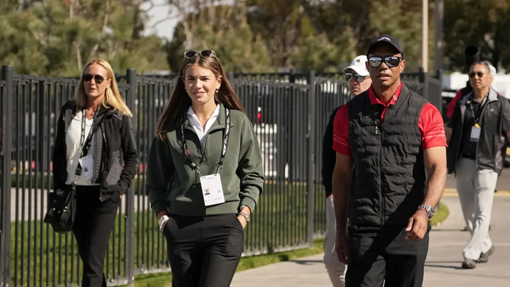 Kai Trump, left, and Tiger Woods arrive to the course during the final round of The Genesis Invitational 2025 at Torrey Pines Golf Course on February 16, 2025, in La Jolla, California. (Michael Owens/Getty Images)